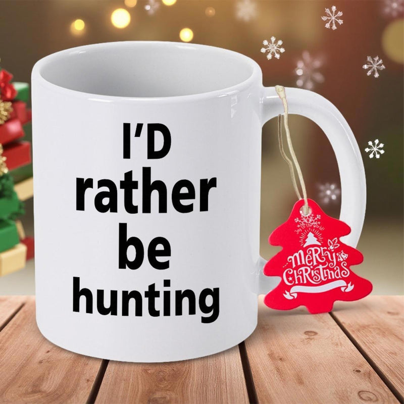 Tailorly White Ceramic 11 oz Mug - Id Rather Be Hunting Merry Christmas Classic White Ceramic Material Standing On A Rustic Tabletop Surface Mug