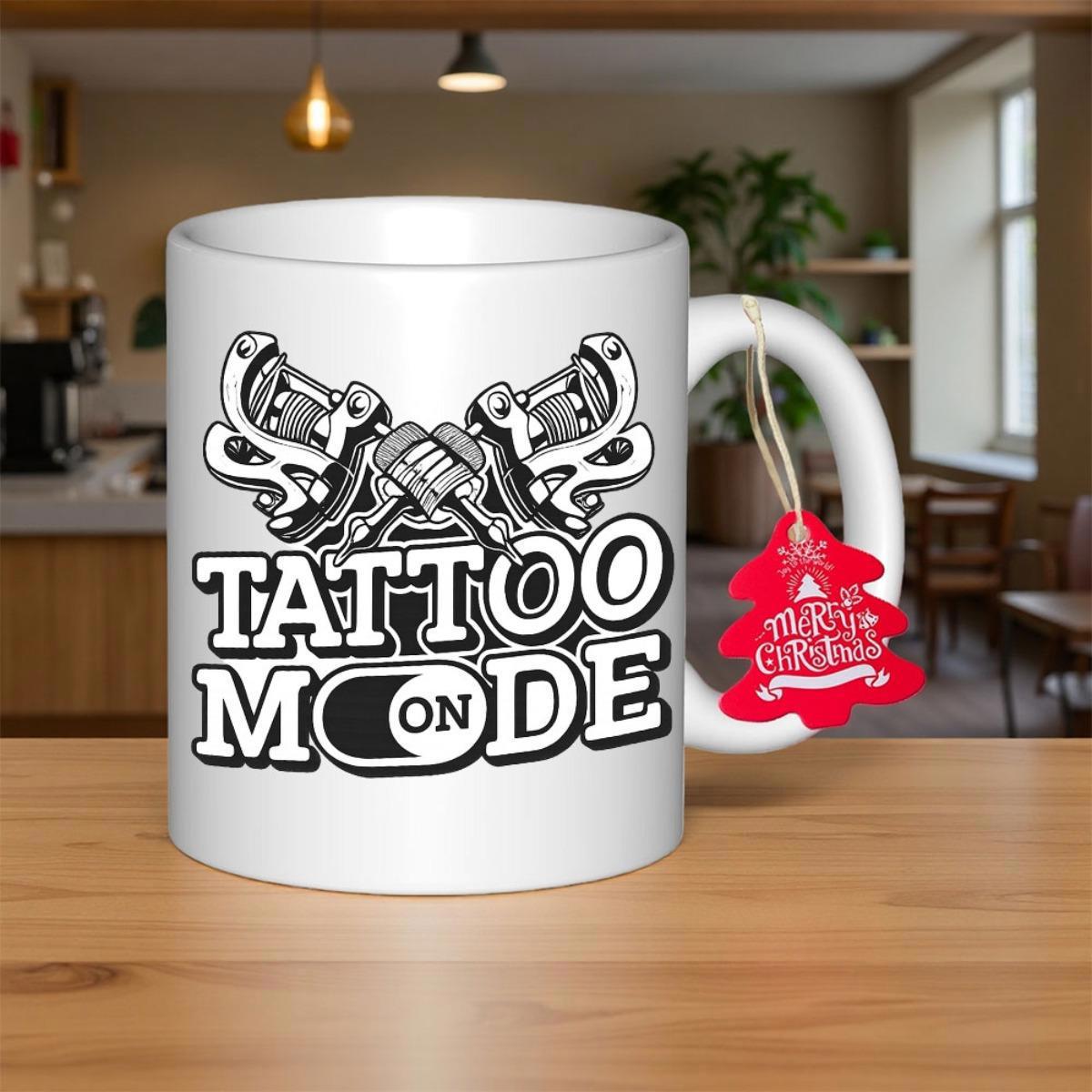 Tailorly White Ceramic 11 oz Mug - Tattoo Mode Intricate Crossed Mechanical Guns Above Bold Stylized Lettering Artistic Machine