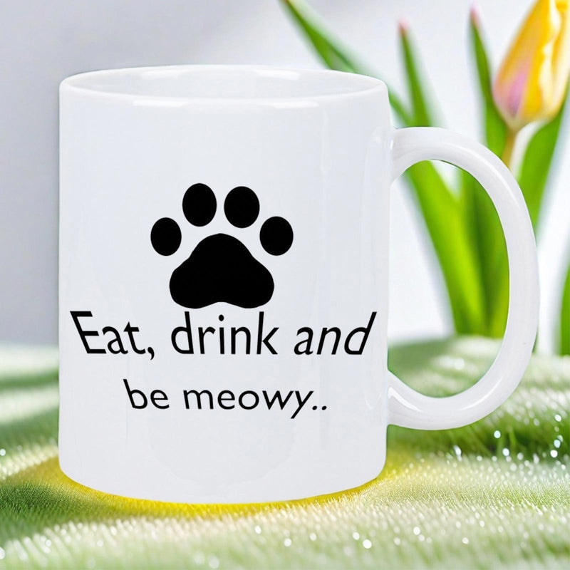 Tailorly White Ceramic 11 oz Mug - Eat Drink And Be Meowy Minimalist Black Ink Style Animal Footprint Symbol On Ceramic Surface Paw Print
