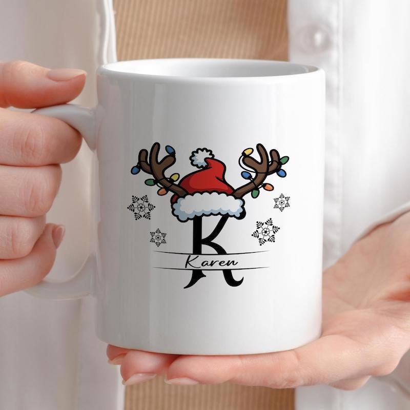 Tailorly White Ceramic 11 oz Mug - Karen Festive Antlers Wearing Red Santa Hat Among Winter Snowflakes Reindeer