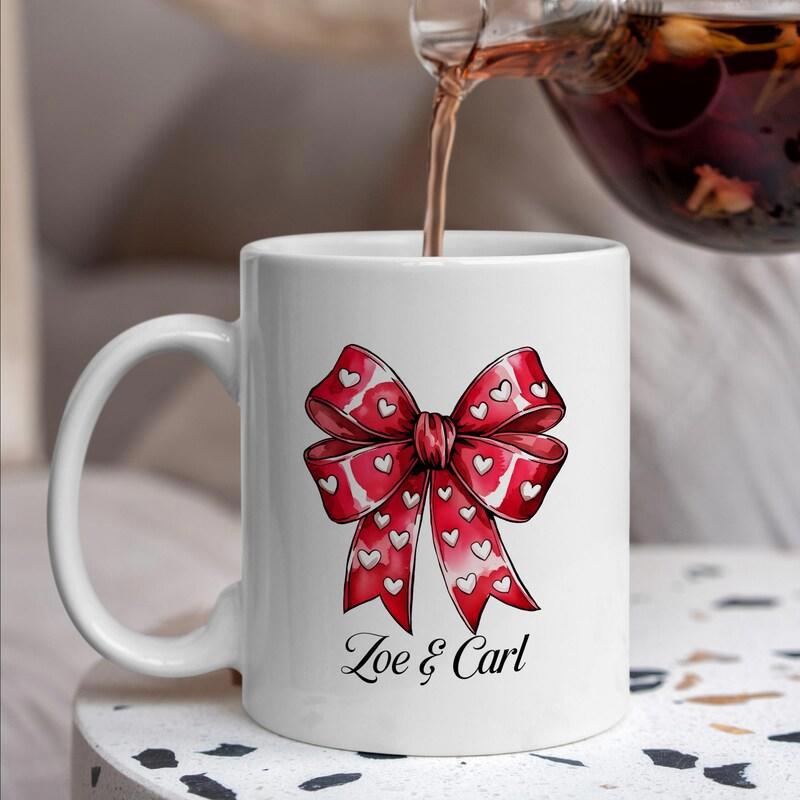 Tailorly White Ceramic 11 oz Mug - Zoe Carl Elegant Red Ribbon With White Heart Patterns Decorative Festive Artistic Bow