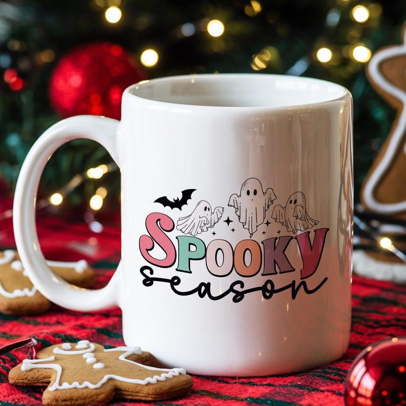 Tailorly White Ceramic 11 oz Mug - Spooky Season Playful Cartoon Ghosts Floating With A Bat Under Magical Twinkling Stars Ghosts