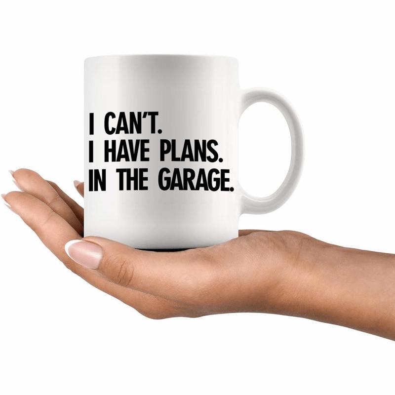 Tailorly White Ceramic 11 oz Mug - I Cant I Have Plans In The Garage Minimalist White Ceramic Vessel Resting Upon A Gentle Human Hand Mug