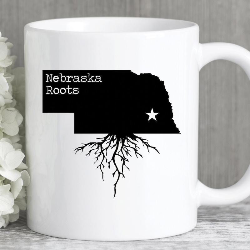 Tailorly White Ceramic 11 oz Mug - Nebraska Roots Black State Outline With Detailed Roots And White Star Map