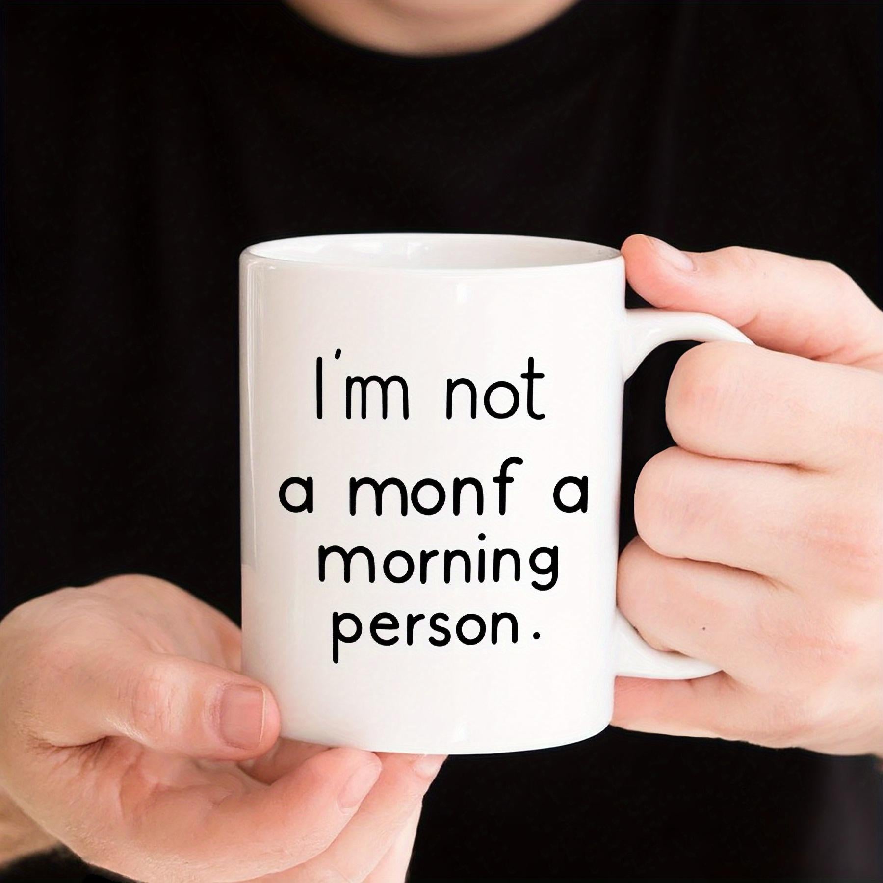 Tailorly White Ceramic 11 oz Mug - Im Not A Monf A Morning Person Sleek White Ceramic Vessel Held By Hands Against A Dark Background Mug