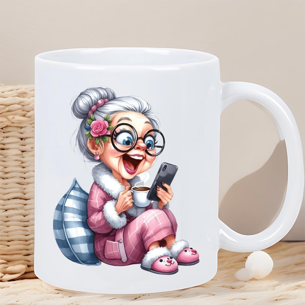 Tailorly White Ceramic 11 oz Mug - Joyful Elderly Woman In Pink Pajamas Holding Coffee And Smartphone Sitting Near Pillow Grandma