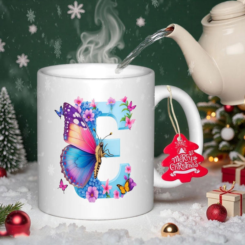 Tailorly White Ceramic 11 oz Mug - Merry Christmas Vibrant Decorative Wings Gracing A Floral Patterned Capital Letter E Butterfly