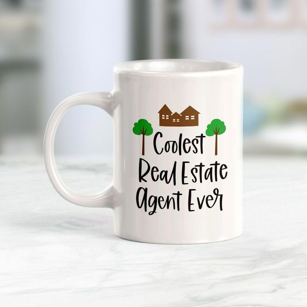 Tailorly White Ceramic 11 oz Mug - Coolest Real Estate Agent Ever Small Brown Houses Nestled Between Green Trees Mug