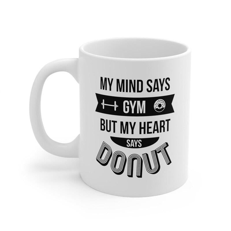 Tailorly White Ceramic 11 oz Mug - My Mind Says Gym But My Heart Says Donut Minimalist Black Ink Gym Symbols Combined With Bold Humorous Quote Mug