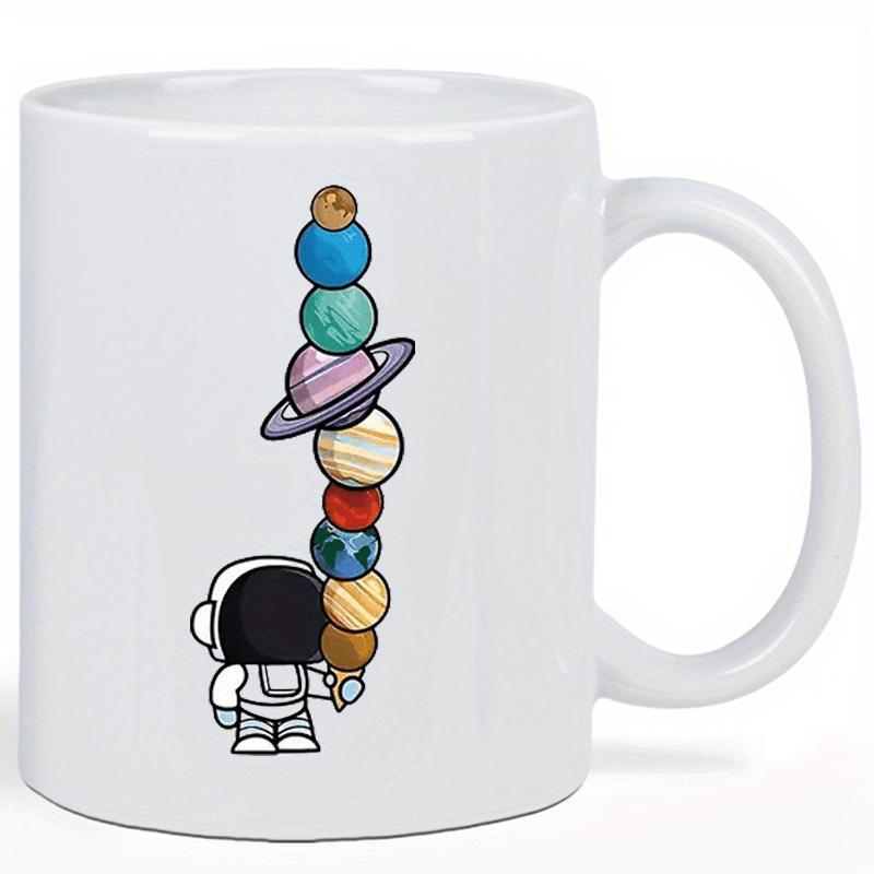 Tailorly White Ceramic 11 oz Mug - Little Astronaut Holding Vertical Stack Of Colorful Solar System Planets Astronaut