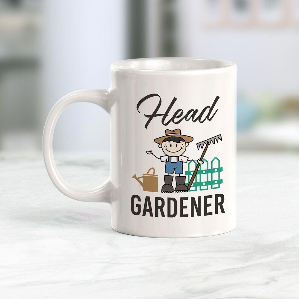 Tailorly White Ceramic 11 oz Mug - Head Gardener Friendly Cartoon Character Holding Rake Near Watering Can And Fence Gardener
