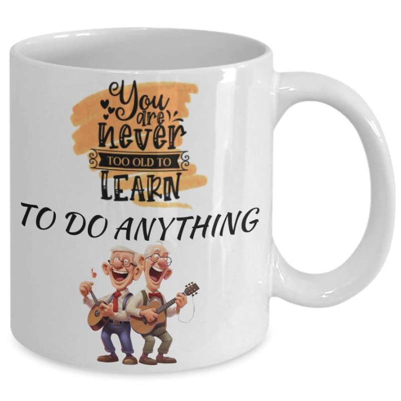 Tailorly White Ceramic 11 oz Mug - You Are Never Too Old To Learn To Do Anything Two Happy Elderly Gentlemen Playing Guitars Under Golden Background Musician