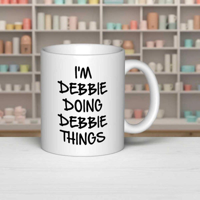 Tailorly White Ceramic 11 oz Mug - Im Debbie Doing Debbie Things Bold Black Hand Written Style Typography Printed On A Clean Surface Mug