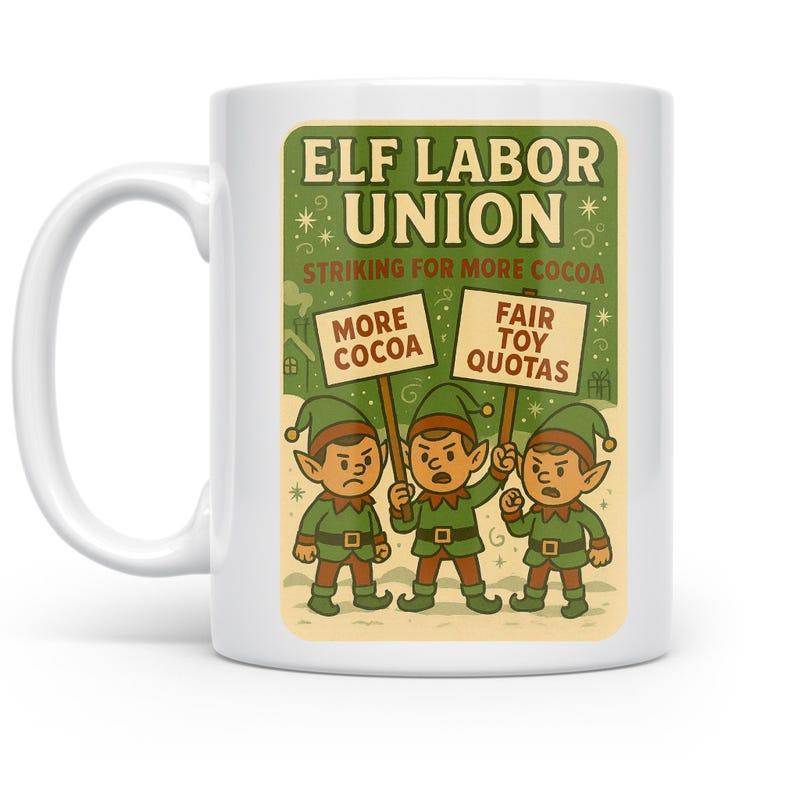 Tailorly White Ceramic 11 oz Mug - Elf Labor Union Striking For More Cocoa Fair Toy Quotas Three Angry Cartoon Elves Holding Protest Signs In Snowy Scene Elf