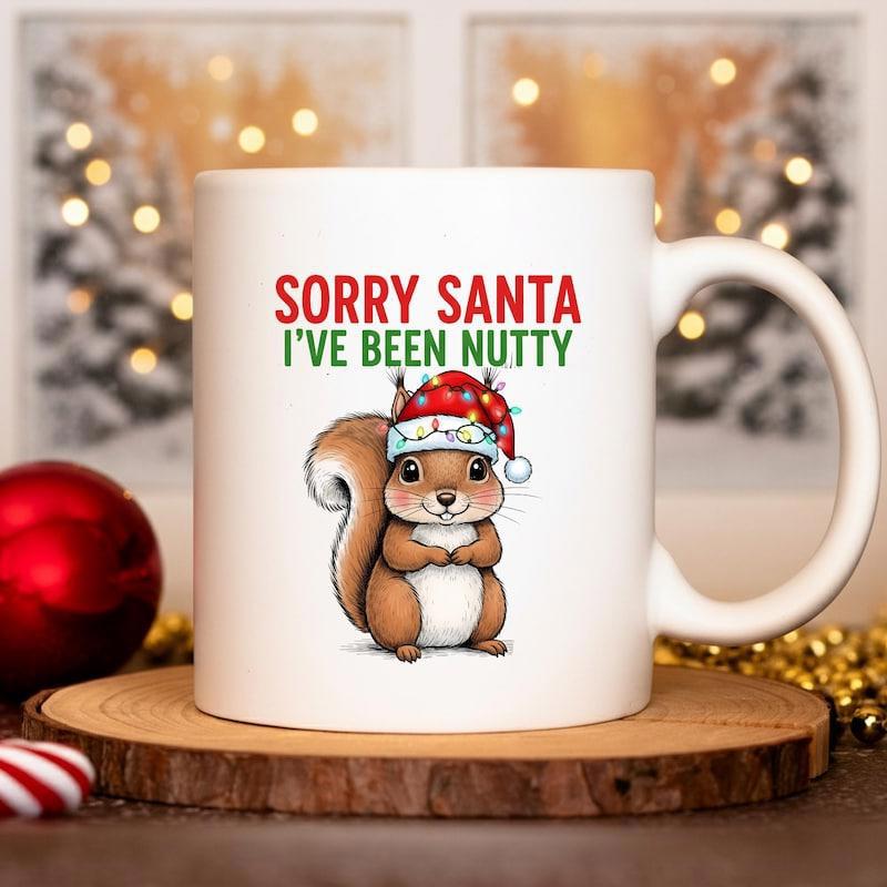 Tailorly White Ceramic 11 oz Mug - Sorry Santa Ive Been Nutty Cute Festive Cartoon Character Wearing Red Hat With Twinkling Lights Squirrel