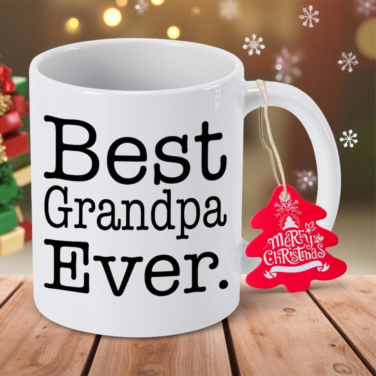 Tailorly White Ceramic 11 oz Mug - Best Grandpa Ever Elegant Ceramic Body Standing Upon Rustic Wood Table Beside Glowing Festive Lights Mug
