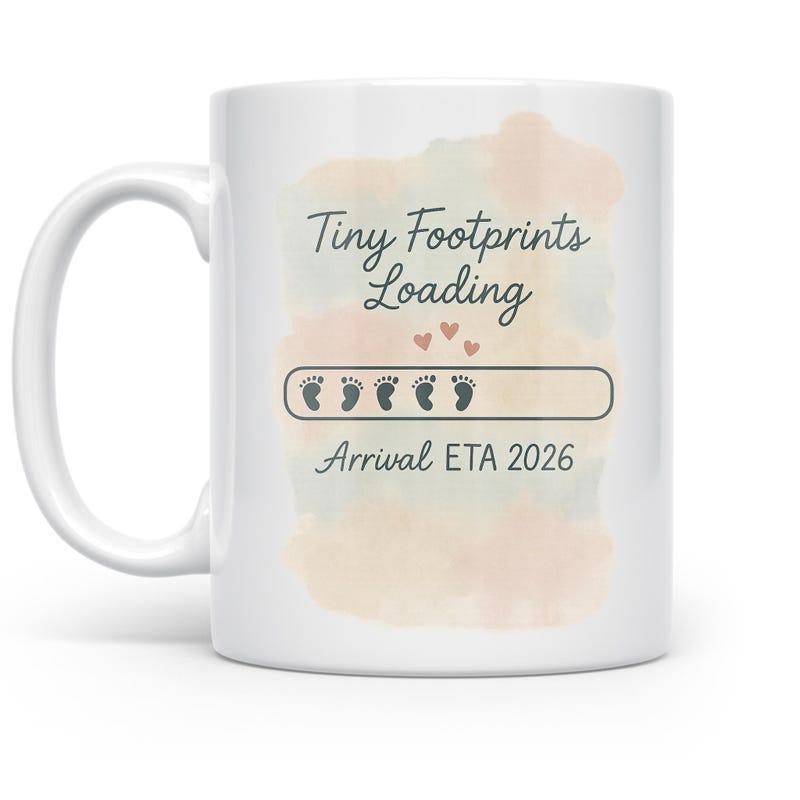 Tailorly White Ceramic 11 oz Mug - Tiny Footprints Loading Arrival ETA 2026 Soft Pastel Watercolor Background With Progress Bar And Cute Baby Footprints Mug