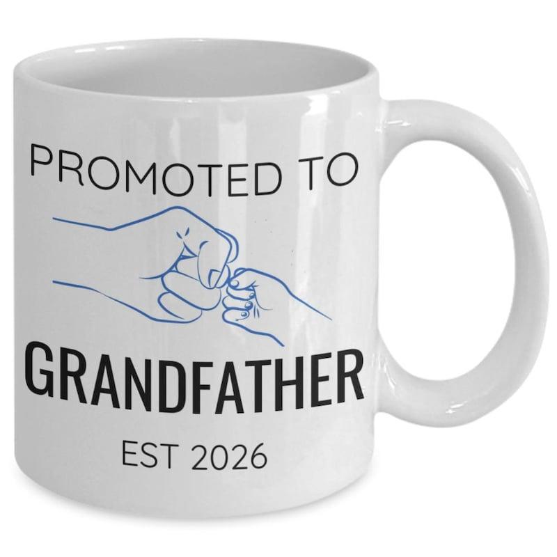 Tailorly White Ceramic 11 oz Mug - Promoted To Grandfather Est 2026 Minimalist Blue Line Drawing Showing Gentle Fist Bump Between Adult And Child Hands
