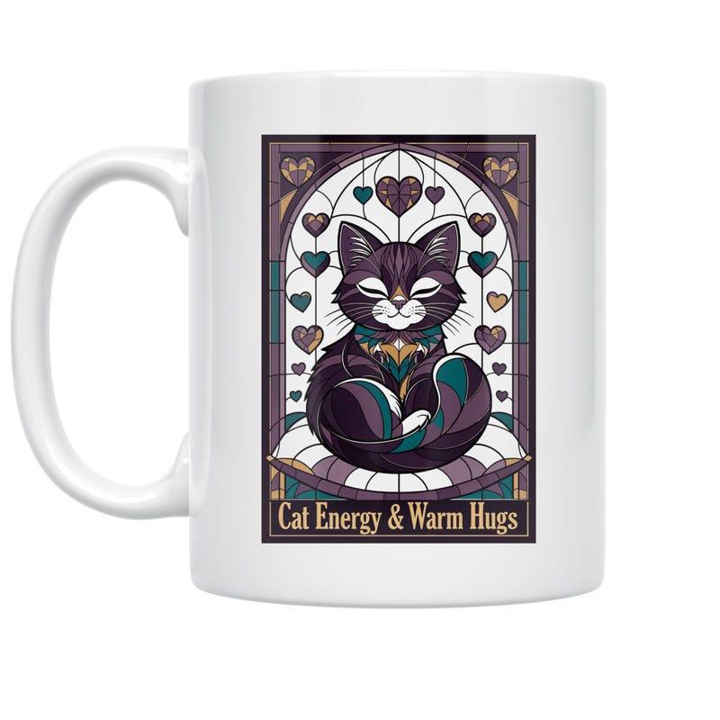 Tailorly White Ceramic 11 oz Mug - Cat Energy Warm Hugs Stylized Resting Black Kitten Beneath Decorative Stained Glass Heart Arch Cat