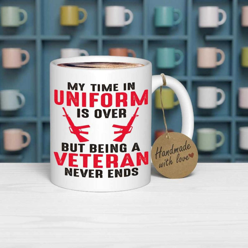 Tailorly White Ceramic 11 oz Mug - My Time In Uniform Is Over But Being A Veteran Never Ends Symmetrical Silhouettes Of Two Weapons Featured Below Bold Red