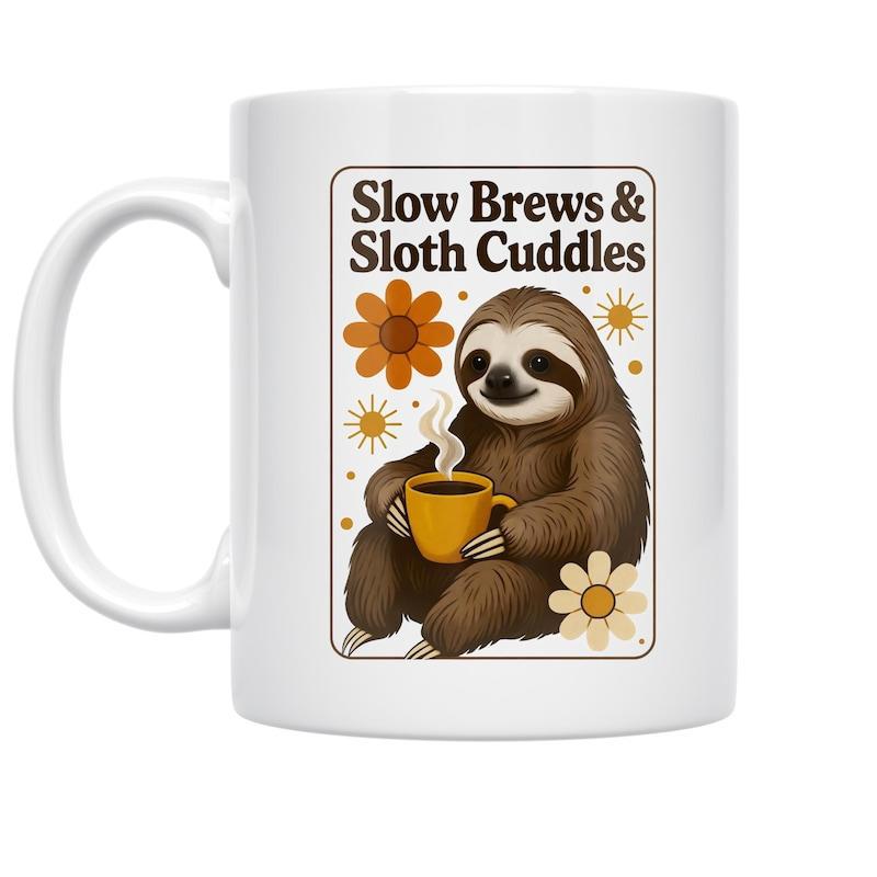 Tailorly White Ceramic 11 oz Mug - Slow Brews Sloth Cuddles Adorable Brown Furry Sloth Holding A Steaming Cup Among Flowers Sloth