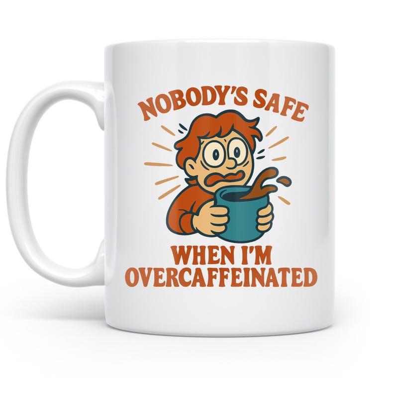 Tailorly White Ceramic 11 oz Mug - Nobodys Safe When Im Overcaffeinated Funny Cartoon Character Holding Splashing Coffee Mug With Wide Surprised Eyes Mug