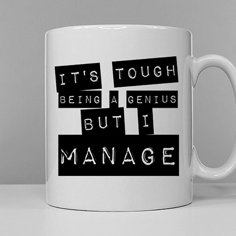 Tailorly White Ceramic 11 oz Mug - Its Tough Being A Genius But I Manage Minimalist Black Label Style Blocks With Bold White Stamped Lettering Quote
