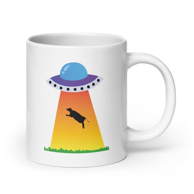 Tailorly White Ceramic 11 oz Mug - Vibrant Alien Spaceship Abducting A Grazing Black Silhouette Cow
