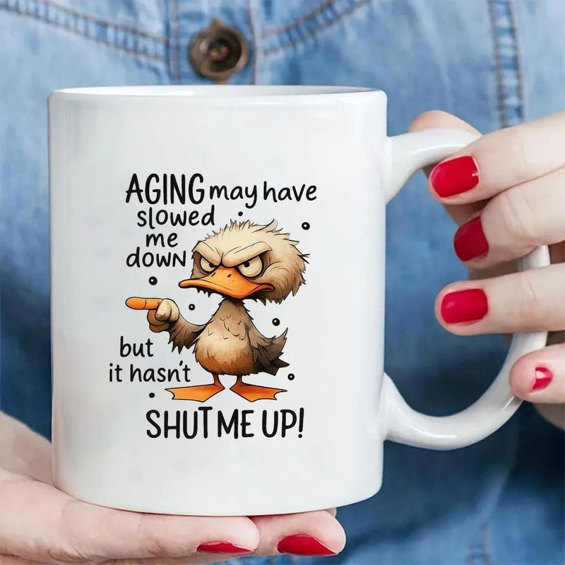 Tailorly White Ceramic 11 oz Mug - Aging May Have Slowed Me Down But It Hasnt Shut Me Up Grumpy Cartoon Duck With Angry Eyebrows And Pointing Wing Duck