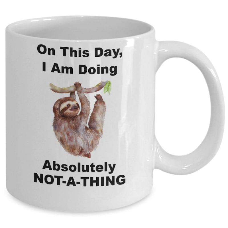 Tailorly White Ceramic 11 oz Mug - On This Day I Am Doing Absolutely Not A Thing Adorable Brown Fur Sloth Hanging From A Thin Wooden Tree Branch Sloth