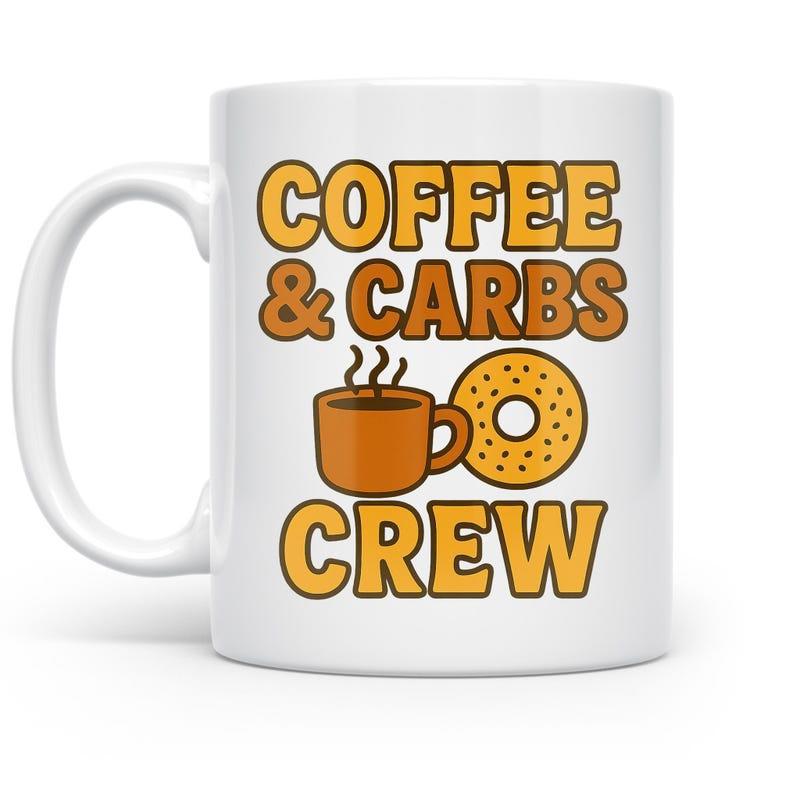 Tailorly White Ceramic 11 oz Mug - Coffee Carbs Crew Steaming Brown Cup Beside A Tasty Golden Glazed Sprinkled Ring Mug