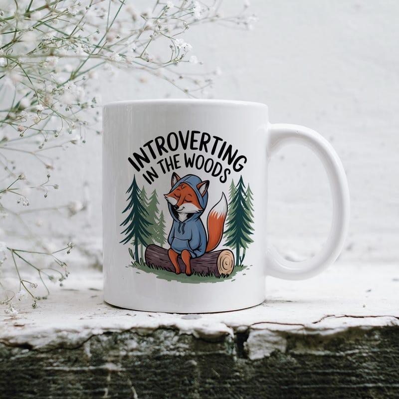 Tailorly White Ceramic 11 oz Mug - Introverting In The Woods Cute Fox Wearing Blue Hoodie Sitting On Log Under Trees Fox