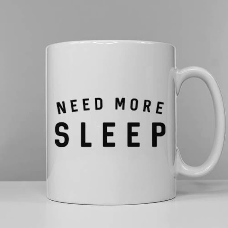 Tailorly White Ceramic 11 oz Mug - Need More Sleep Simple Bold Black Block Letters Printed On A Smooth White Surface Mug