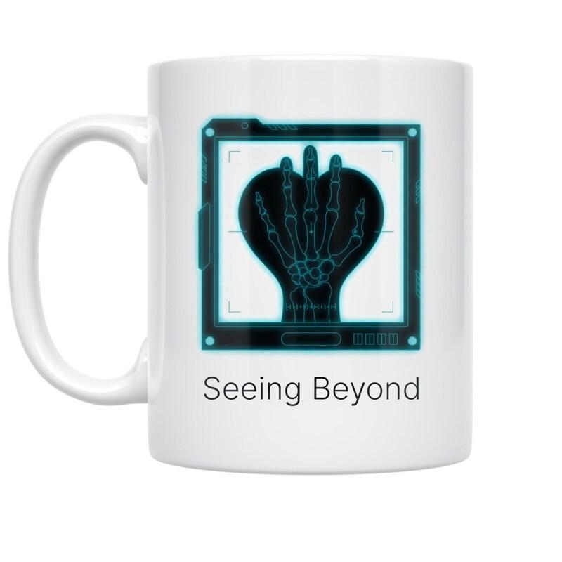 Tailorly White Ceramic 11 oz Mug - Seeing Beyond Digital Screen Frame Protecting A Heart Shaped Skeletal Hand Mug