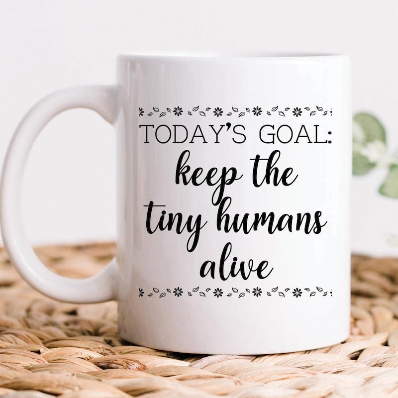 Tailorly White Ceramic 11 oz Mug - Todays Goal Keep The Tiny Humans Alive Simple Minimalist Floral Borders Framing A Humorous Parenting Slogan Ceramic Mug