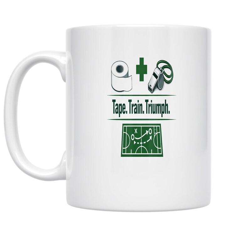 Tailorly White Ceramic 11 oz Mug - Tape Train Triumph Athletic Training Gear With Whistle And Tape Over A Tactical Play Field Mug