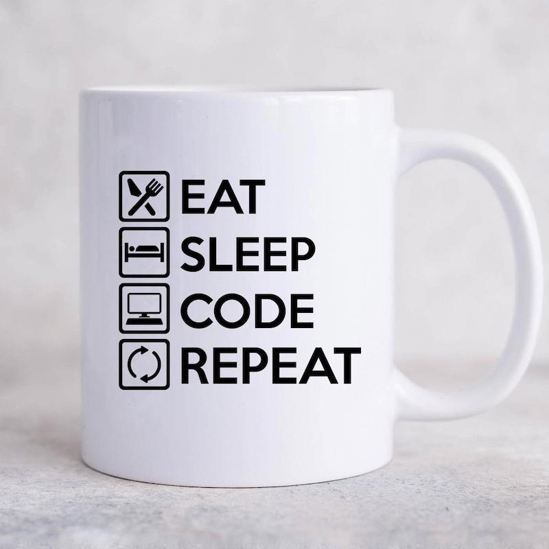Tailorly White Ceramic 11 oz Mug - Eat Sleep Code Repeat Minimalist Icons Displaying Daily Routine Elements On Ceramic Surface Mug