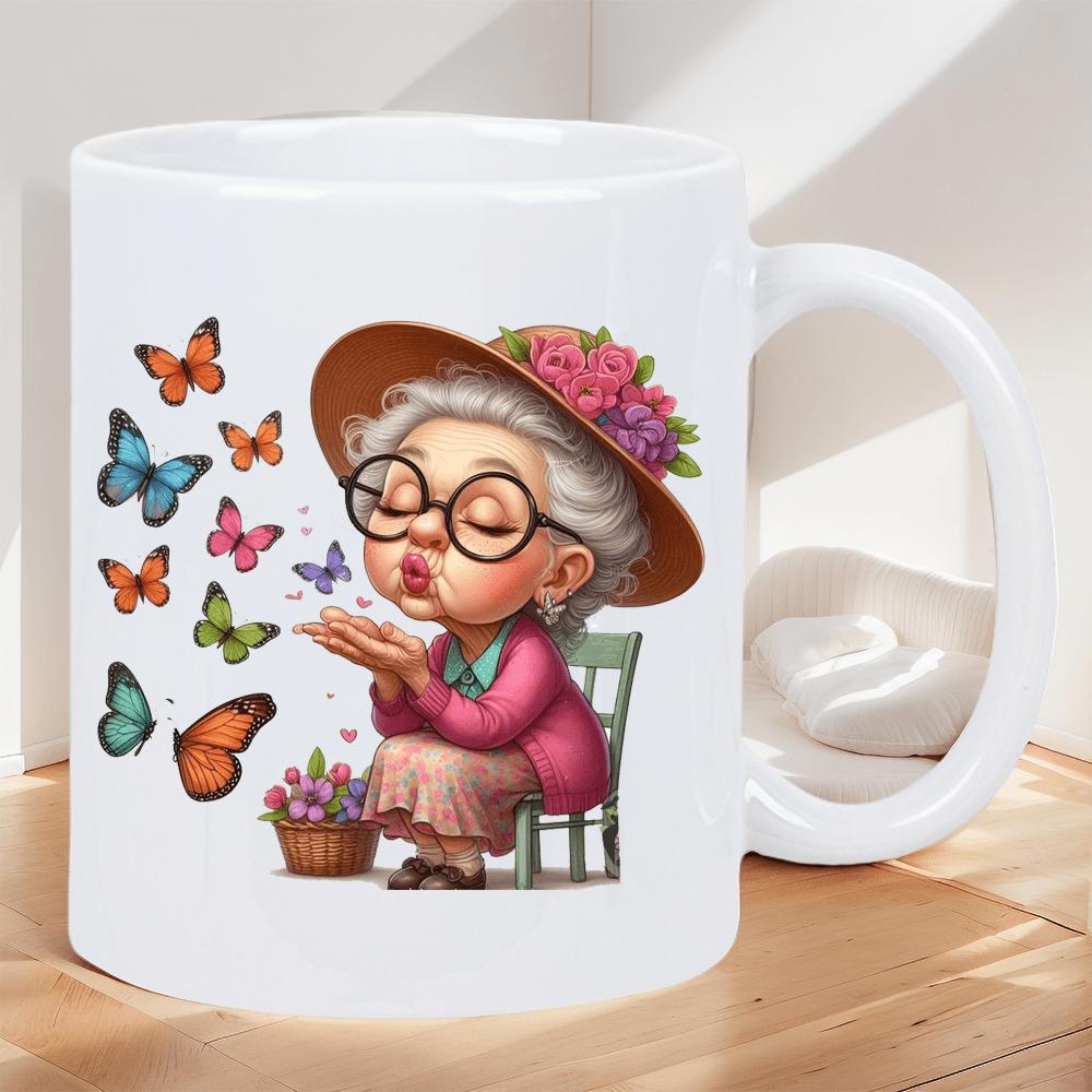 Tailorly White Ceramic 11 oz Mug - Charming Elderly Lady Sitting Among Colorful Butterflies Blowing A Gentle Kiss Grandmother