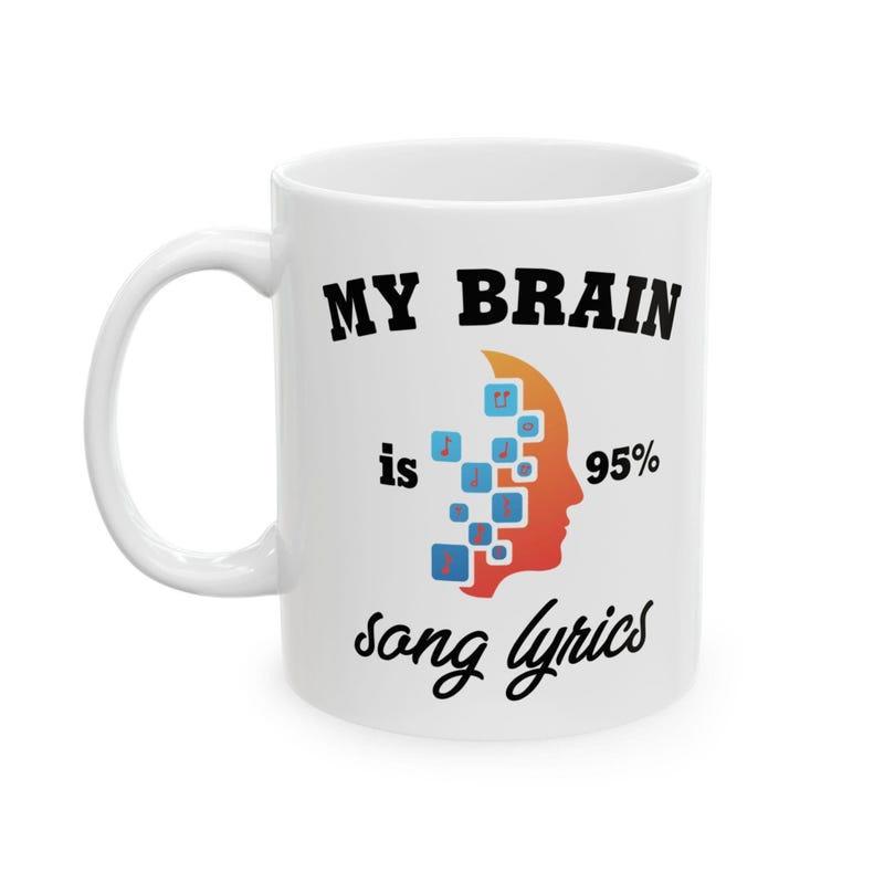 Tailorly White Ceramic 11 oz Mug - My Brain Is 95% Song Lyrics Vibrant Orange Gradient Silhouette Of A Human Head With Pixels Head