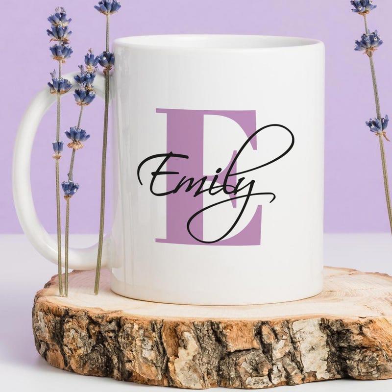 Tailorly White Ceramic 11 oz Mug - Emily Elegant Cursive Script Over Large Purple Letter Surrounded By Lavender Flower Mug