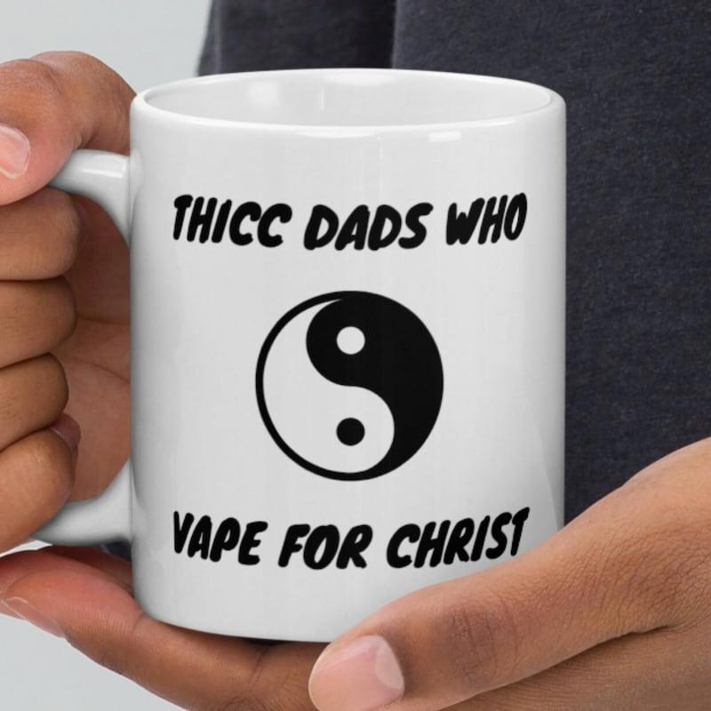 Tailorly White Ceramic 11 oz Mug - Thicc Dads Who Vape For Christ Minimalist Yin Yang Symbol Centered Between Bold Black Sans Serif Typography Mug