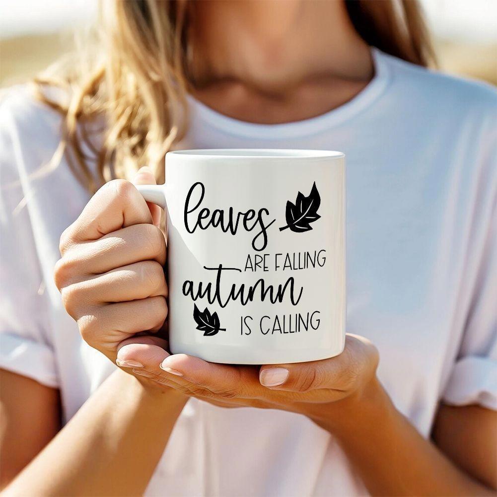 Tailorly White Ceramic 11 oz Mug - Leaves Are Falling Autumn Is Calling Two Simple Black Falling Leaves Silhouettes Set Against A Crisp White Background Leaf