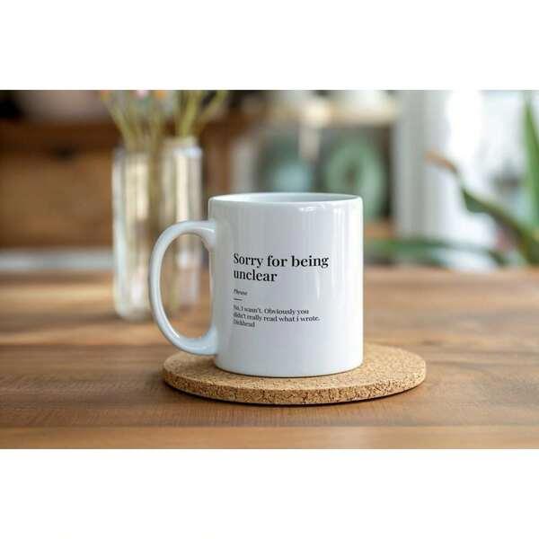 Tailorly White Ceramic 11 oz Mug - Sorry For Being Unclear Sleek Minimalist White Ceramic Coffee Cup Resting Upon A Natural Cork Coaster Mug