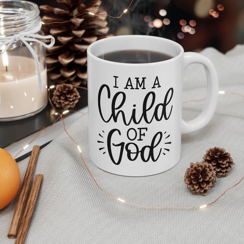 Tailorly White Ceramic 11 oz Mug - I Am A Child Of God Elegant Black Script Typography Among Warm Cozy Winter Decoration Elements Mug