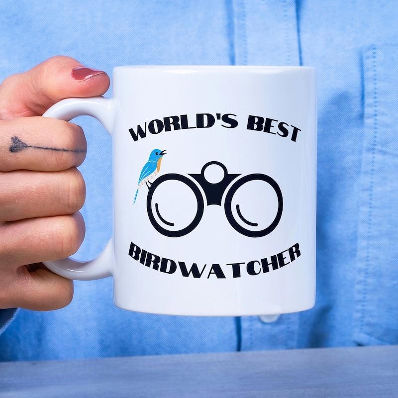 Tailorly White Ceramic 11 oz Mug - World's Best Birdwatcher Small Blue Bird Resting On Professional Field Glass Gear Binoculars
