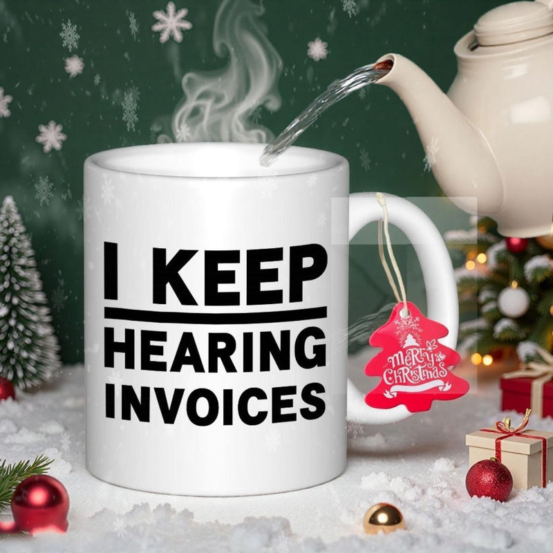 Tailorly White Ceramic 11 oz Mug - I Keep Hearing Invoices Minimalist White Ceramic Vessel With Bold Black Typography Displayed Among Festive Winter Holiday