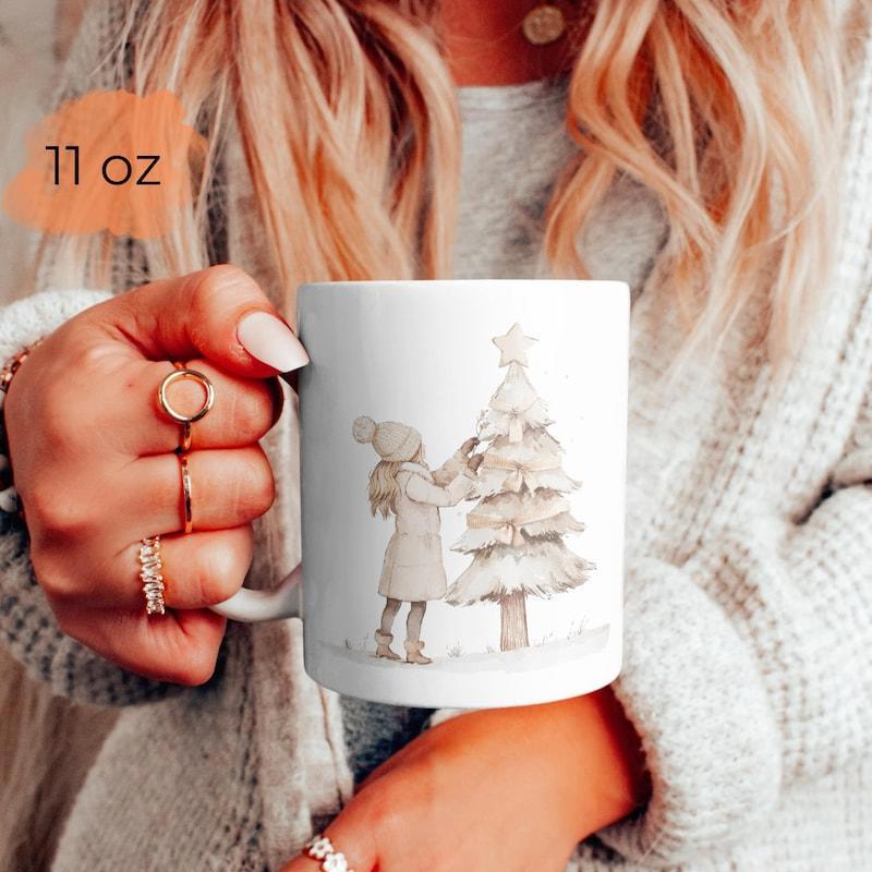 Tailorly White Ceramic 11 oz Mug - Watercolor Style Girl Decorating Snowy Winter Holiday Pine With Golden Star Christmas Tree