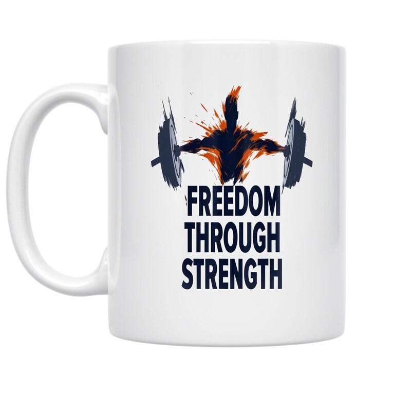 Tailorly White Ceramic 11 oz Mug - Freedom Through Strength Powerful Silhouette Of A Weightlifter Lifting A Heavy Barbell With Fiery Sparks Weightlifter