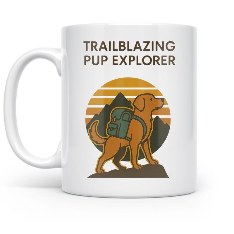 Tailorly White Ceramic 11 oz Mug - Trailblazing Pup Explorer Adventurous Golden Retriever Wearing Backpack Standing On Rugged Mountain Dog
