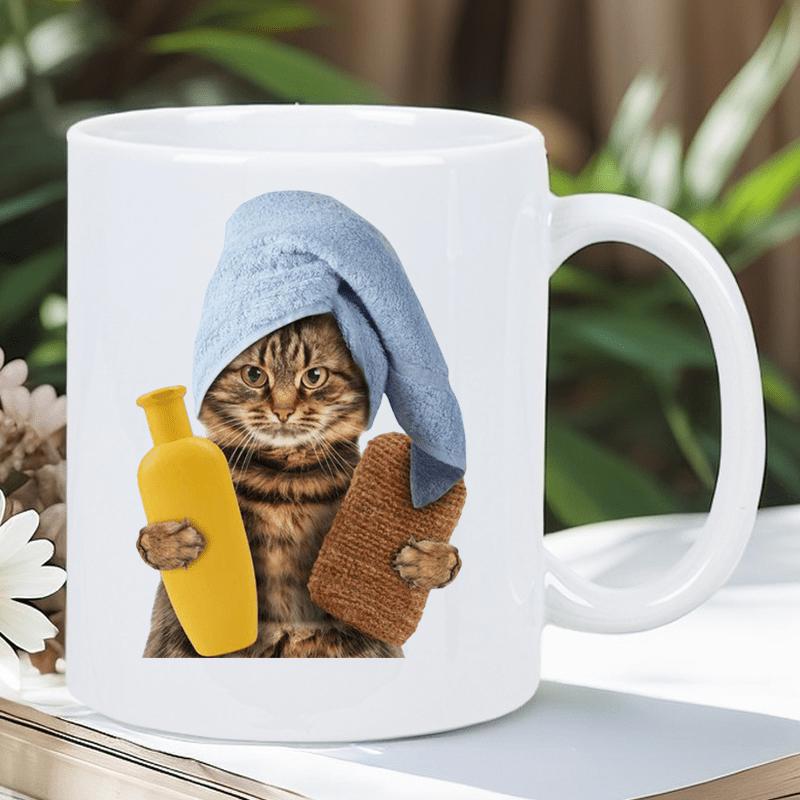 Tailorly White Ceramic 11 oz Mug - Tabby Cat Wearing Blue Towel Holding Yellow Bottle And Brown Sponge Cat